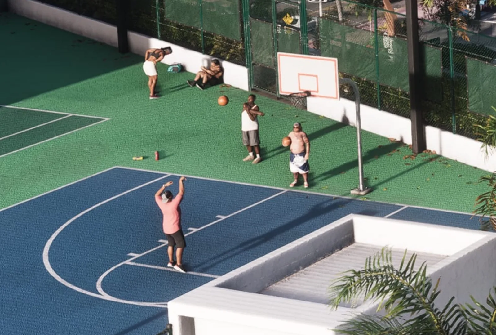 GTA 6 style artwork of a pick-up basketball game on a Vice City court.