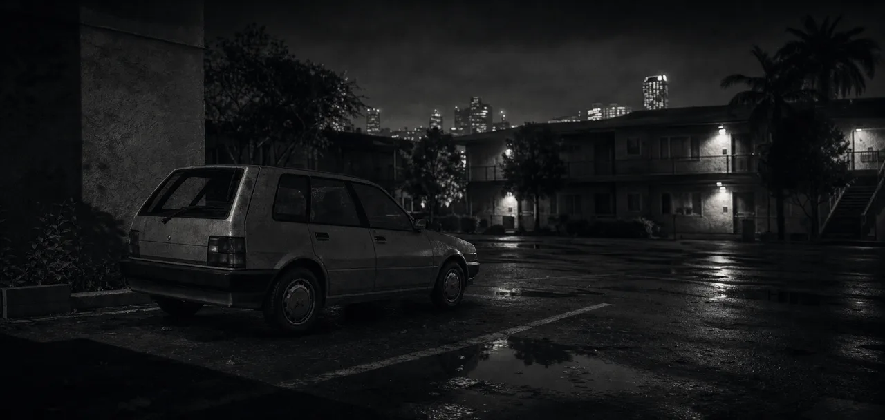 Black and white cinematic concept image of a compact economy hatchback parked in a quiet apartment lot at night