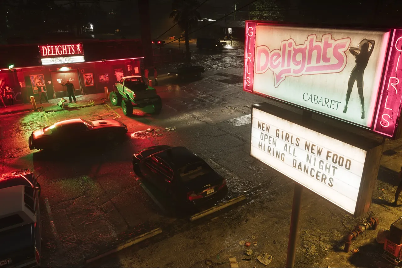 Delights Cabaret at night, its pink Girls-flanked roadside sign advertising new girls, new food and hiring dancers over a wet parking lot