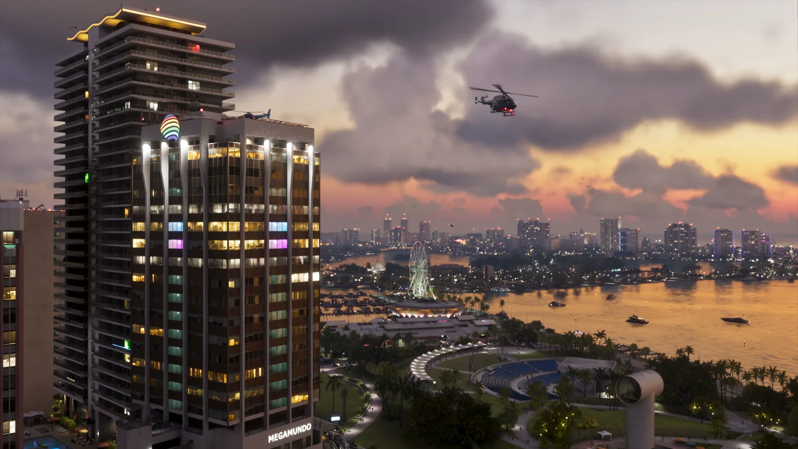 Aerial view of the Megamundo tower at dusk with the bayfront park and observation wheel below in GTA 6.