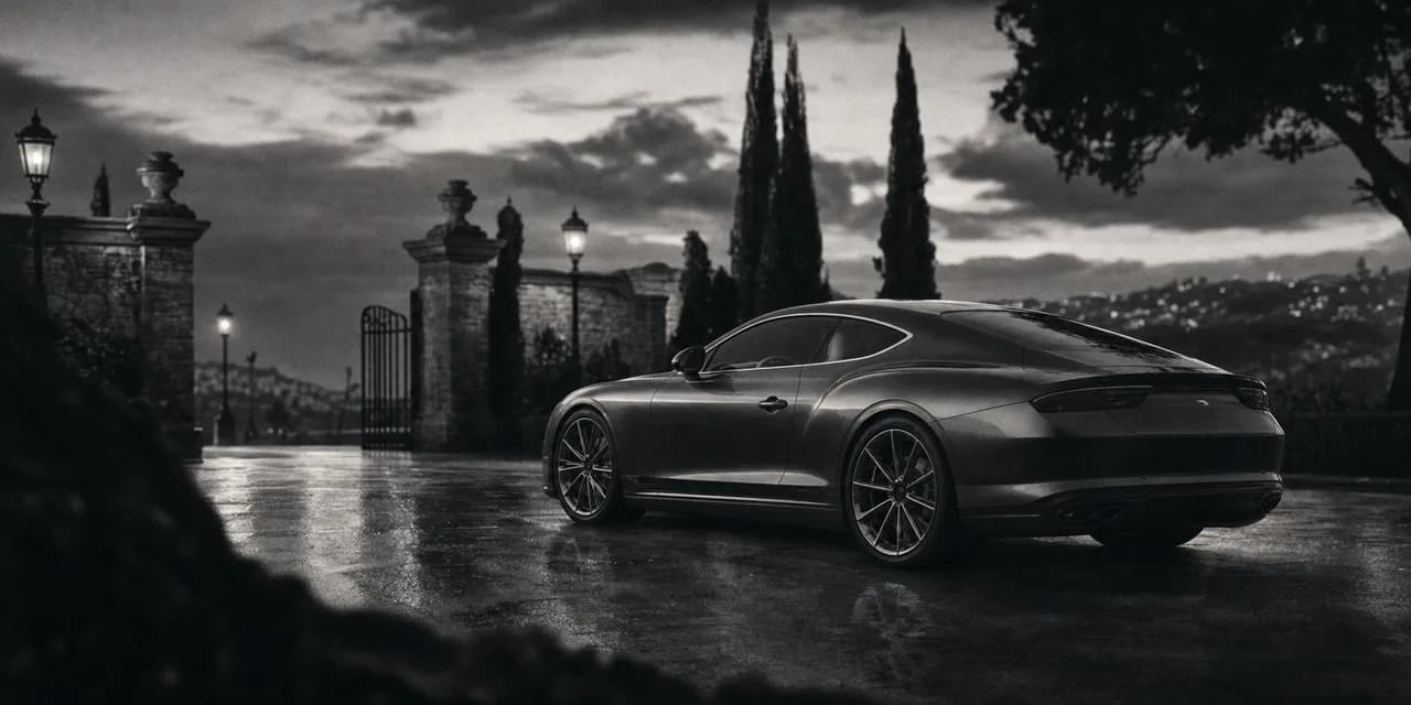 Black and white cinematic concept image of a graceful British grand-touring coupe parked outside an estate at twilight