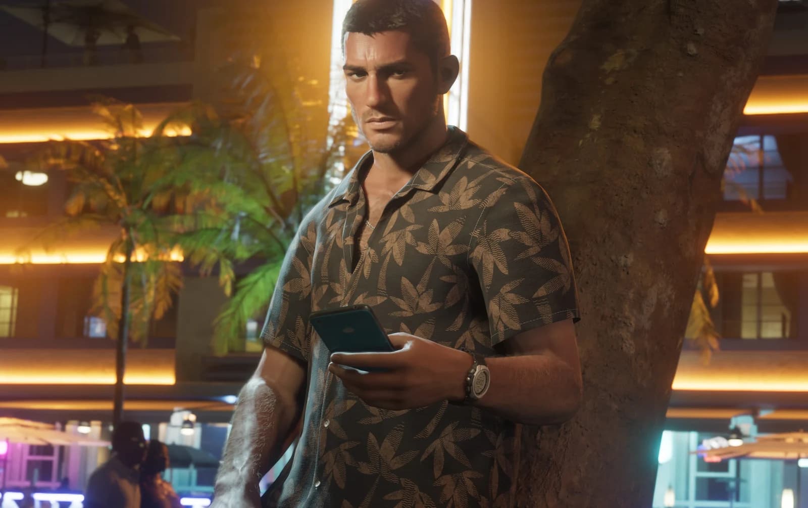 Jason Duval seated in a car, wearing a white Leonida Marine Centre tank top and a backwards baseball cap, palm trees visible through the window.