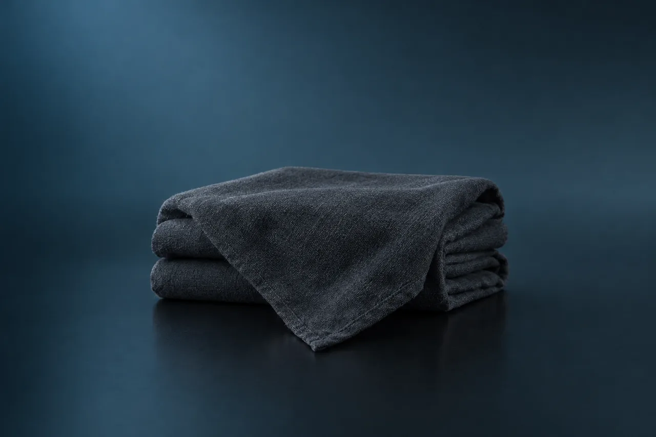 Folded dark grey cloth wrap with one corner draped forward, placeholder render for the GTA 6 Face Wrap concealment gear