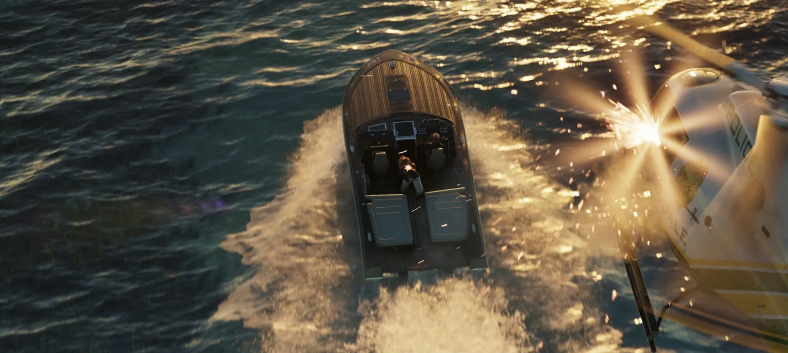 Lucia in a wooden speedboat carving a wake in Vice City waters at golden hour while a Vale County police helicopter closes in from the right, illustrating how far a GTA 6 offshore trip really goes