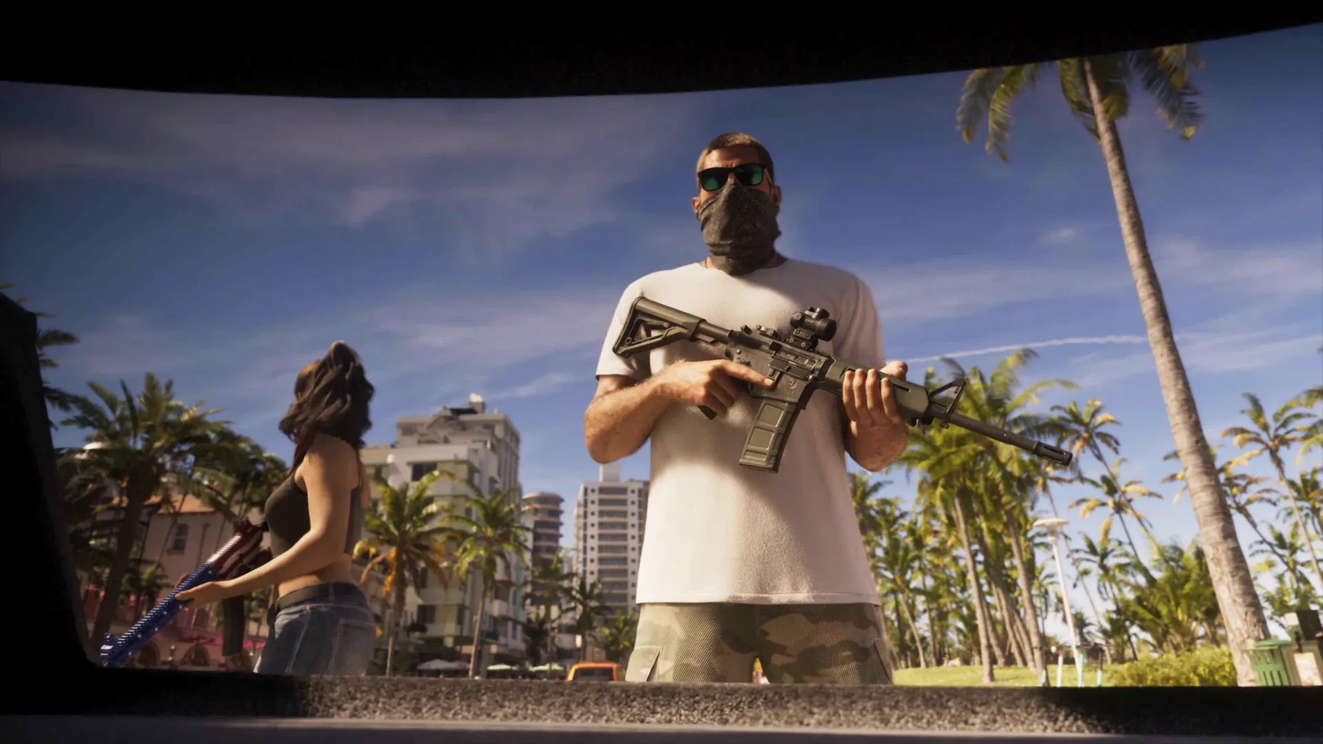 A masked man in a white T-shirt holding a rifle stands beside a dark-haired woman with a flag-painted shotgun, framed from inside an open car boot in GTA 6