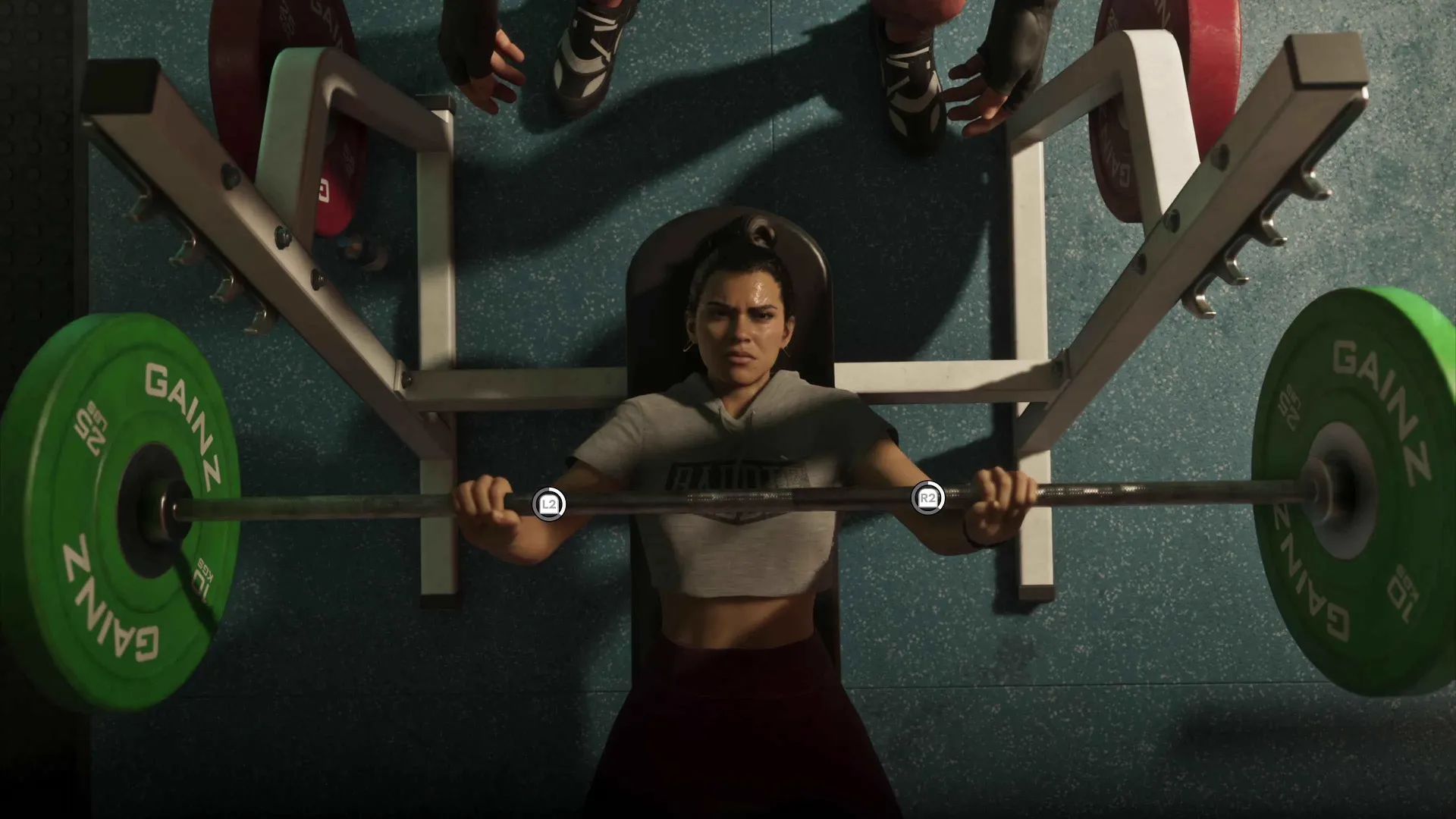 Top-down view of Lucia bench pressing a barbell with green Gainz weight plates and L2 and R2 button prompts in a GTA 6 gym