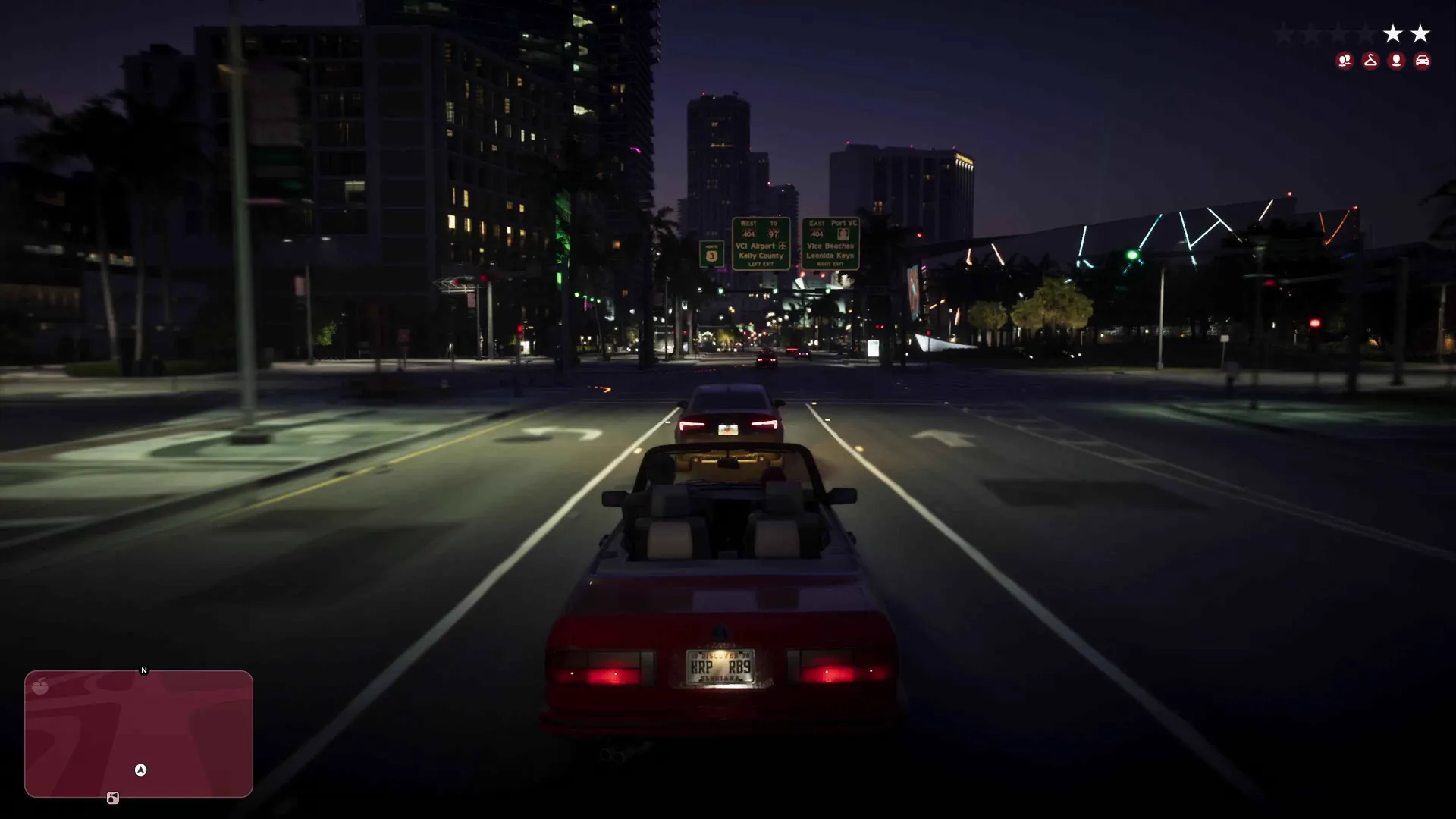 A red convertible speeds down a night highway past signs for VCI Airport and Vice Beaches with two wanted stars showing in GTA 6