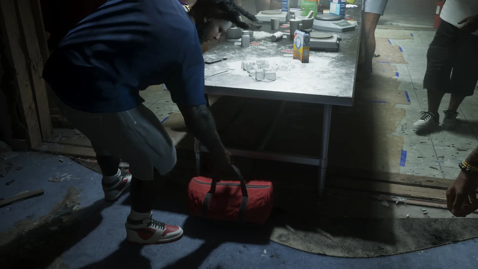 Jason grabbing the red bag of product from the drug lab table in the GTA 6 Extended Look