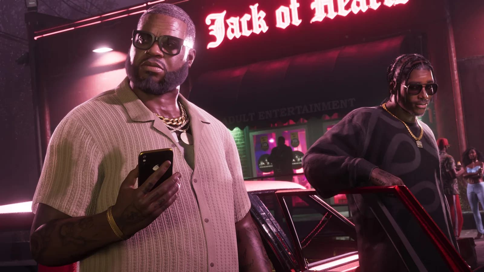 Two men outside the Jack of Hearts club at night in GTA 6, one checking his phone beside a red car
