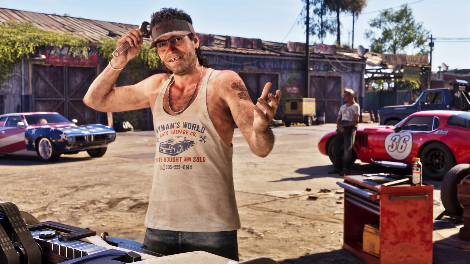A GTA 6 mechanic in a Wyman’s World Auto Salvage tank top shrugs at his shop with muscle cars in the background, an unofficial mascot for anyone confused about GTA 6 region-locked codes