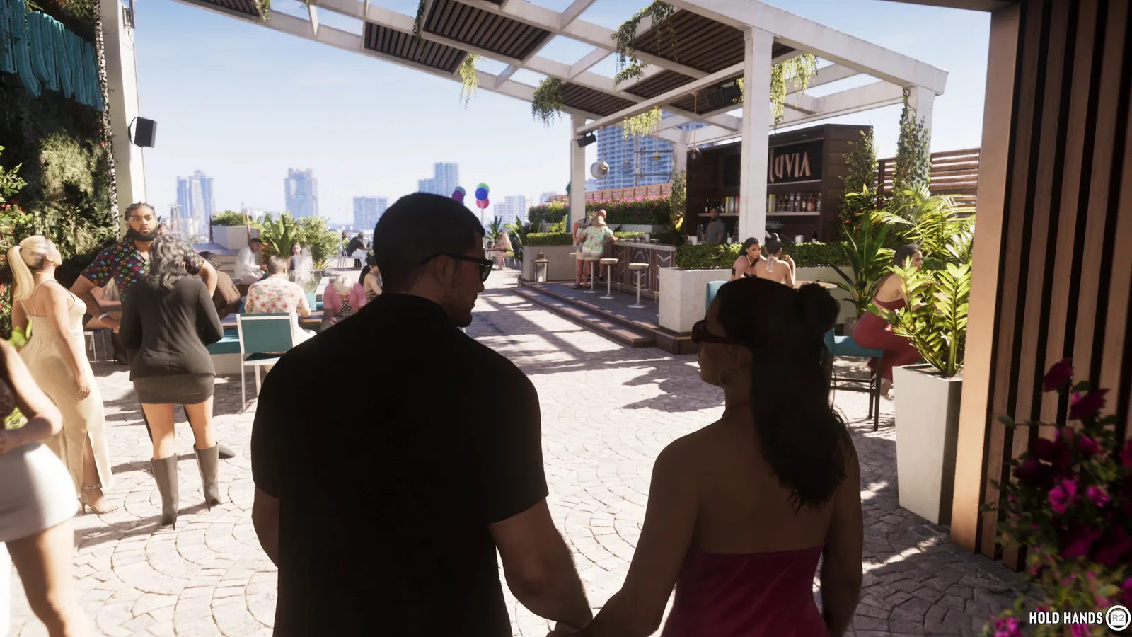 Jason and Lucia holding hands as they walk through Effluvia’s rooftop terrace