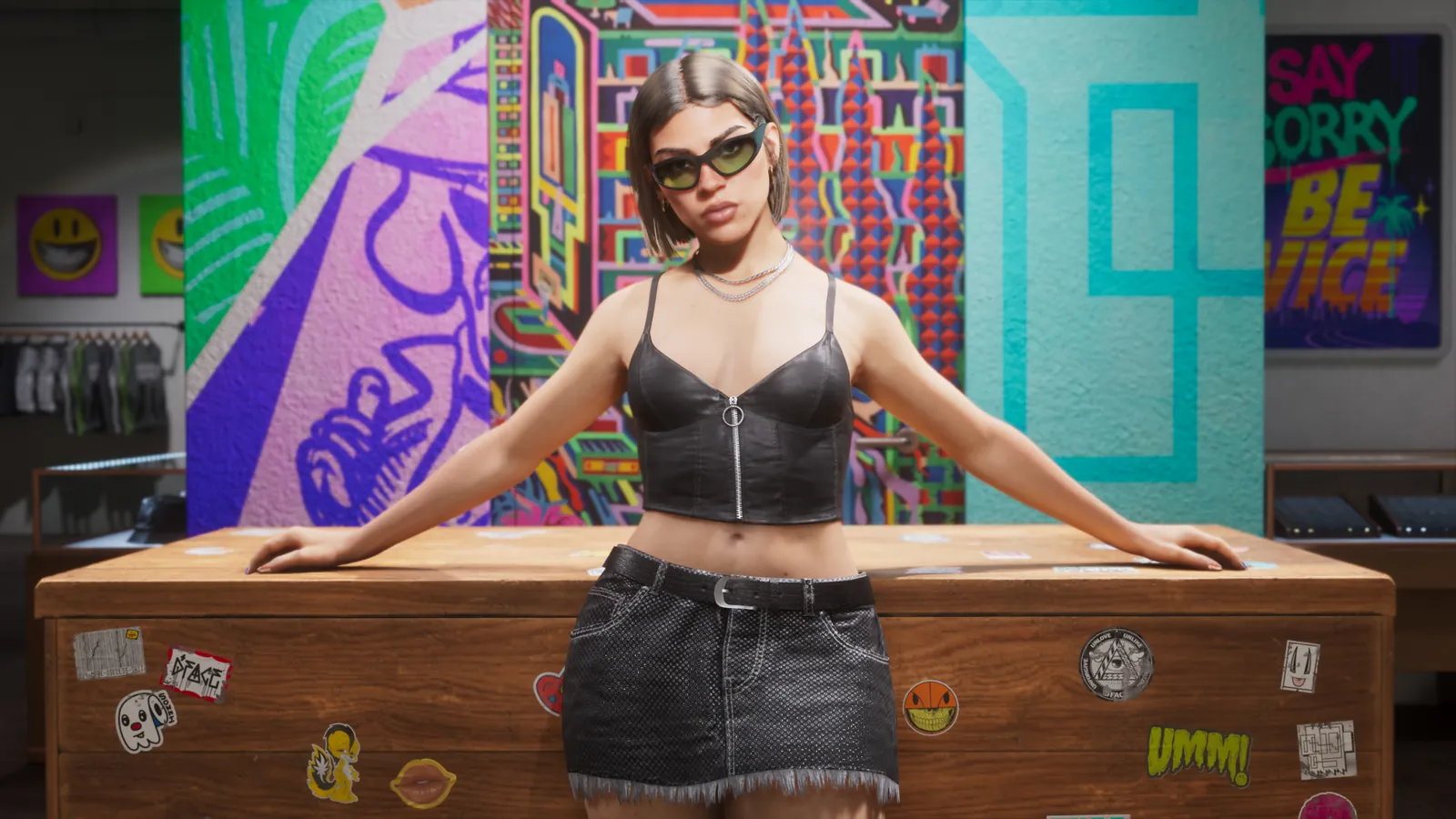 Lucia leaning on a sticker-covered counter in front of a graffiti wall inside Stock 305 in an official GTA 6 screenshot