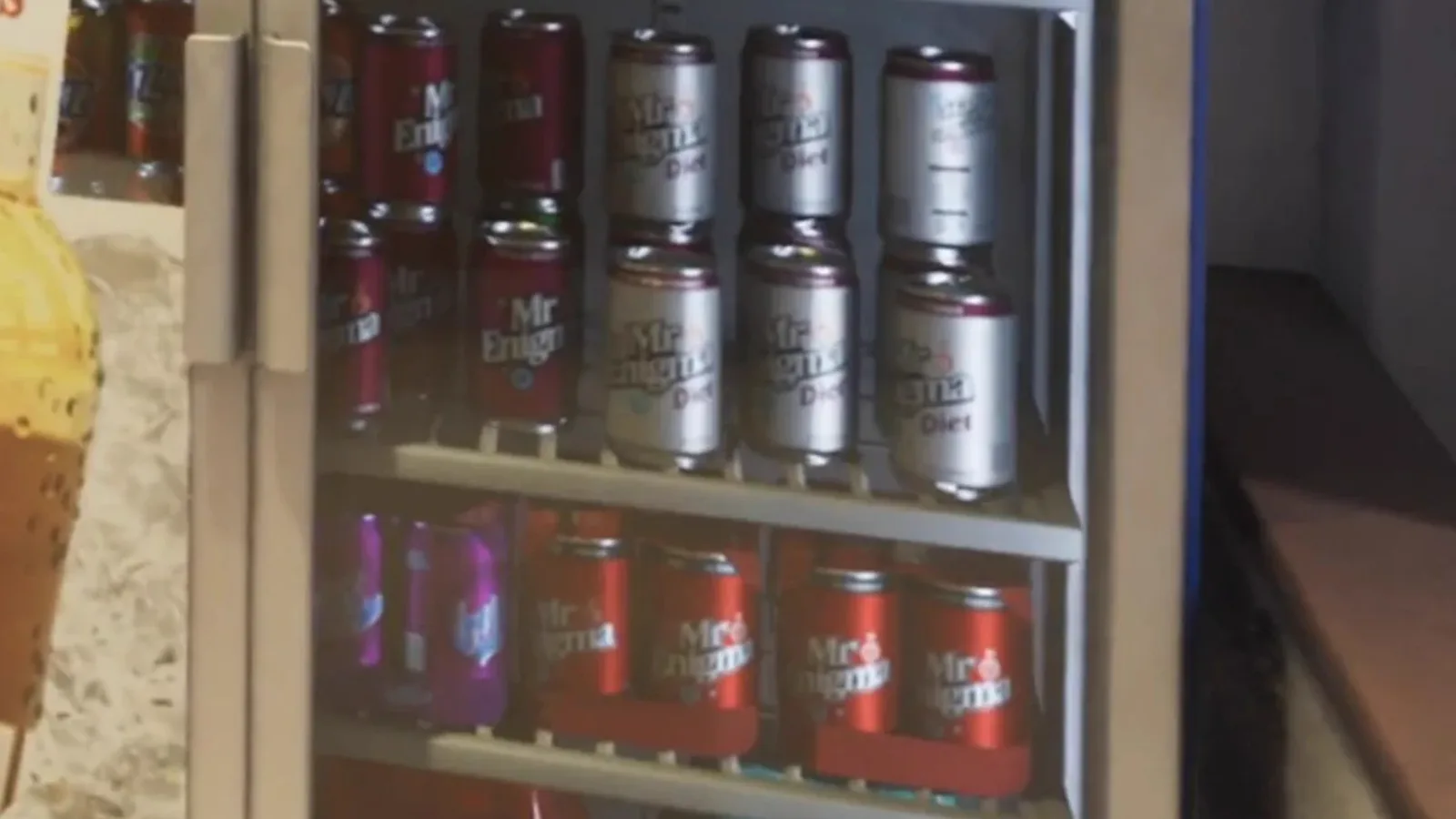 Mr. Enigma soda cans lined up in a store fridge in the GTA 6 Extended Look