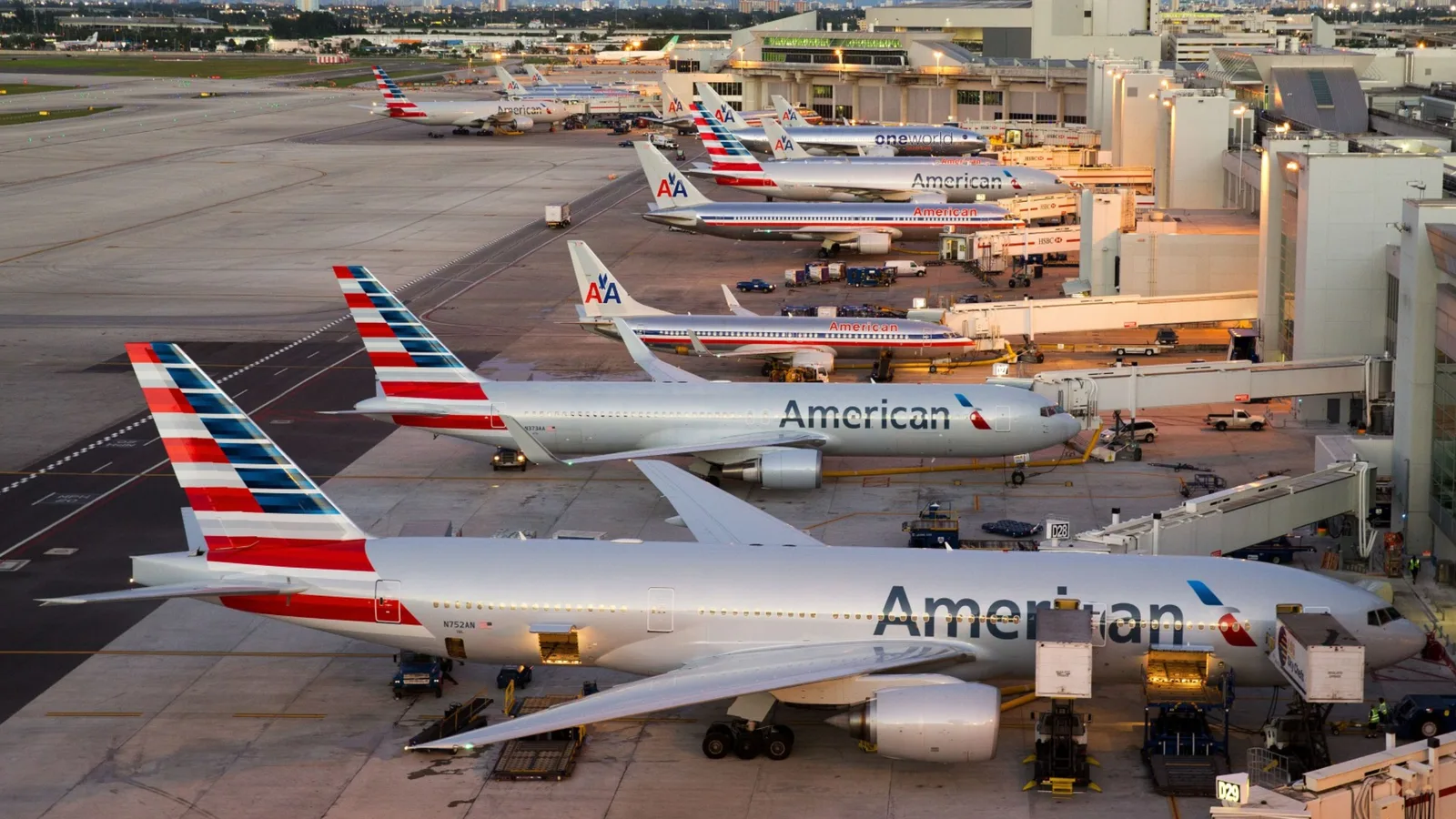 Airliners lined up at their gates on the airport apron