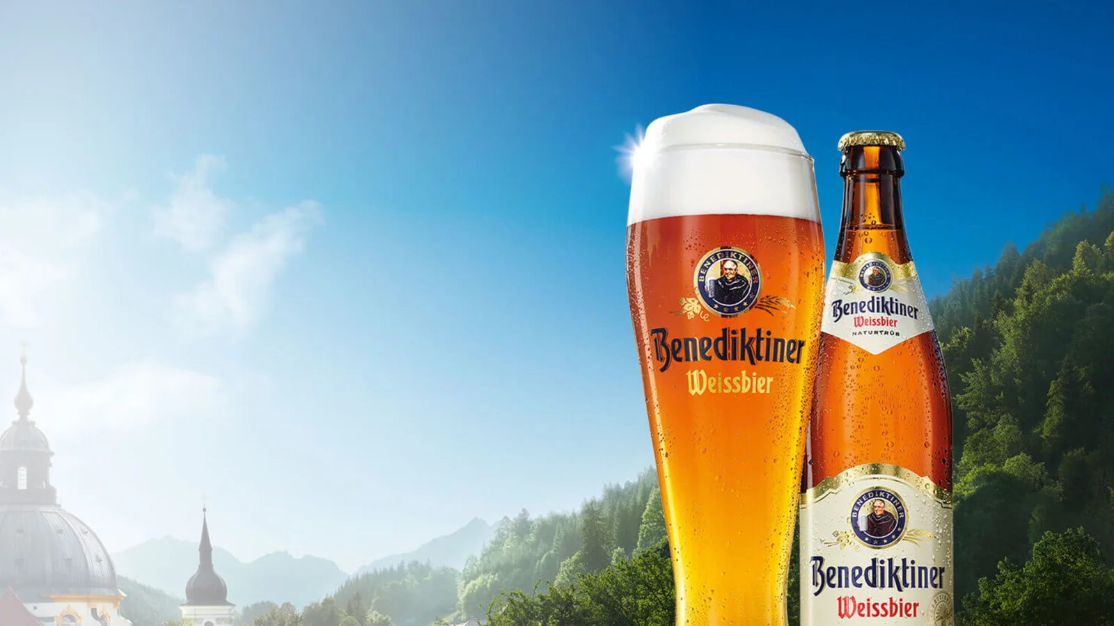 Benediktiner wheat beer glass and bottle against an alpine backdrop