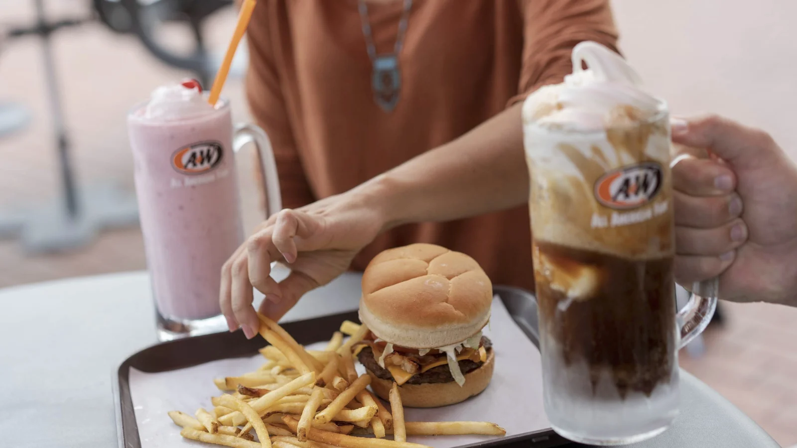 A&W root beer floats in frosted mugs at a diner