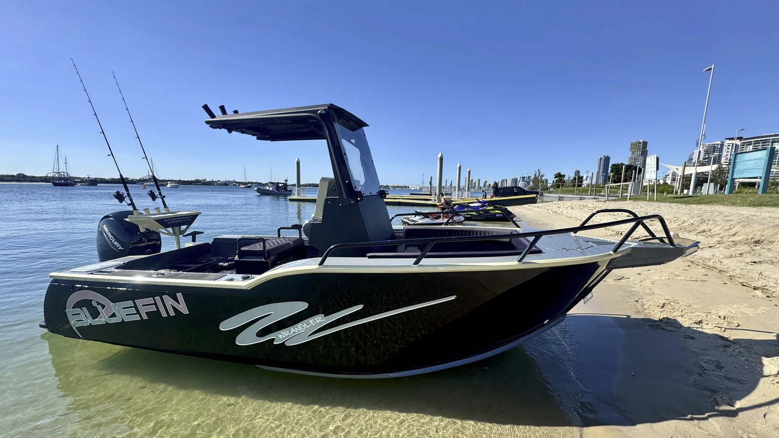 A small centre console boat pulled up on the sand