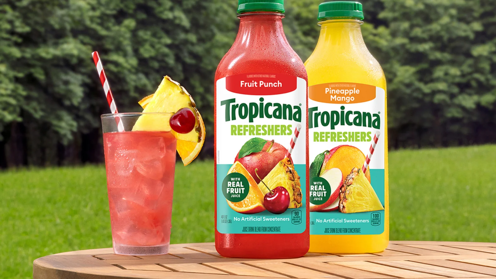 Tropicana juice bottles on a garden table