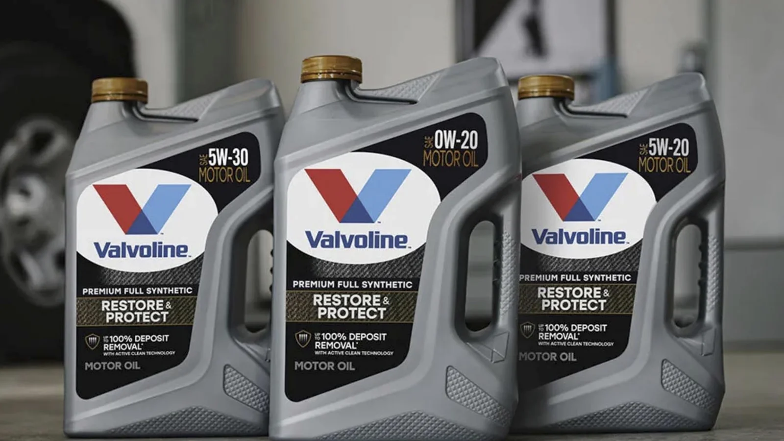 Valvoline synthetic motor oil bottles lined up on a workbench