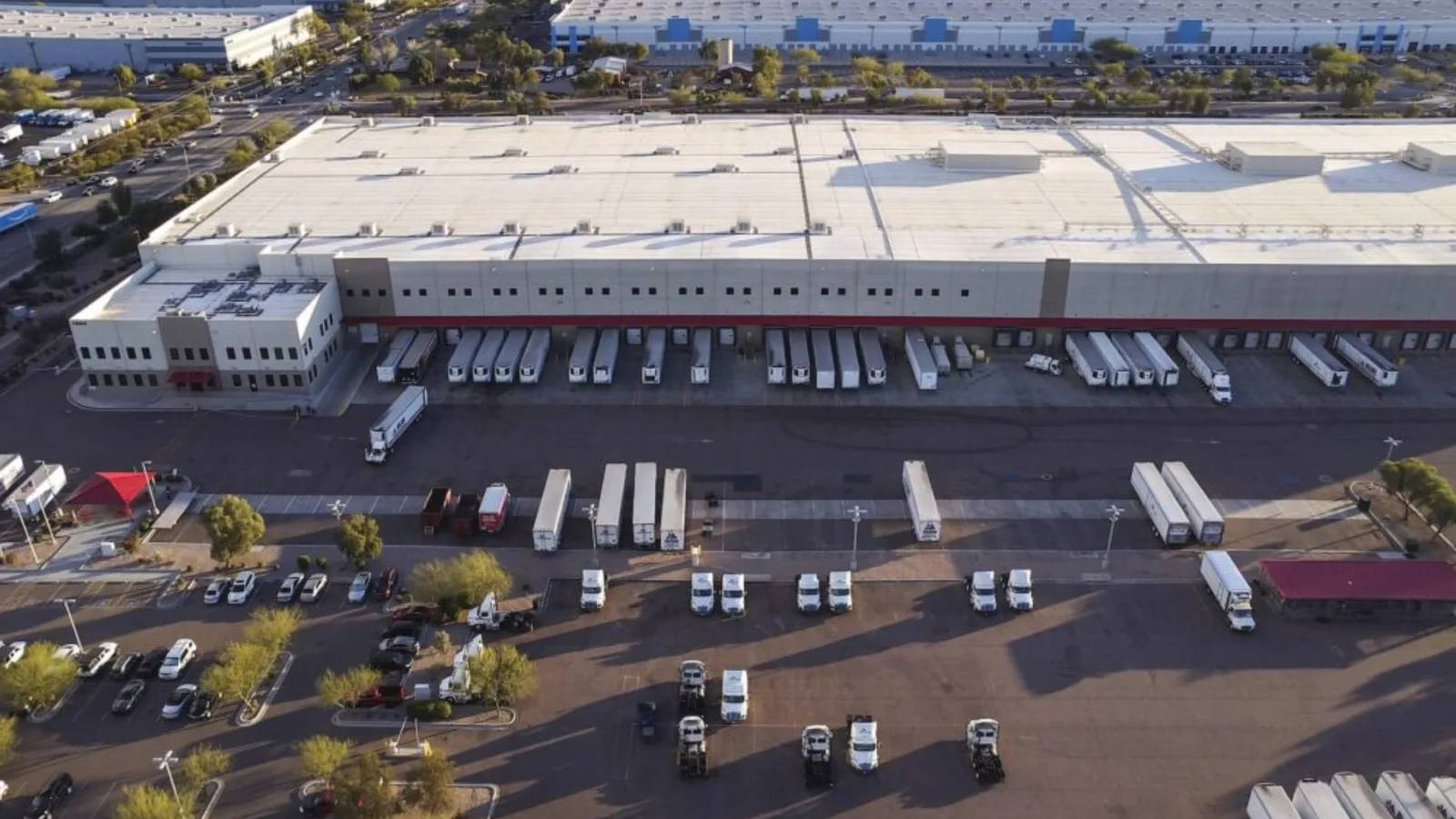 Aerial view of trailers docked at a distribution warehouse