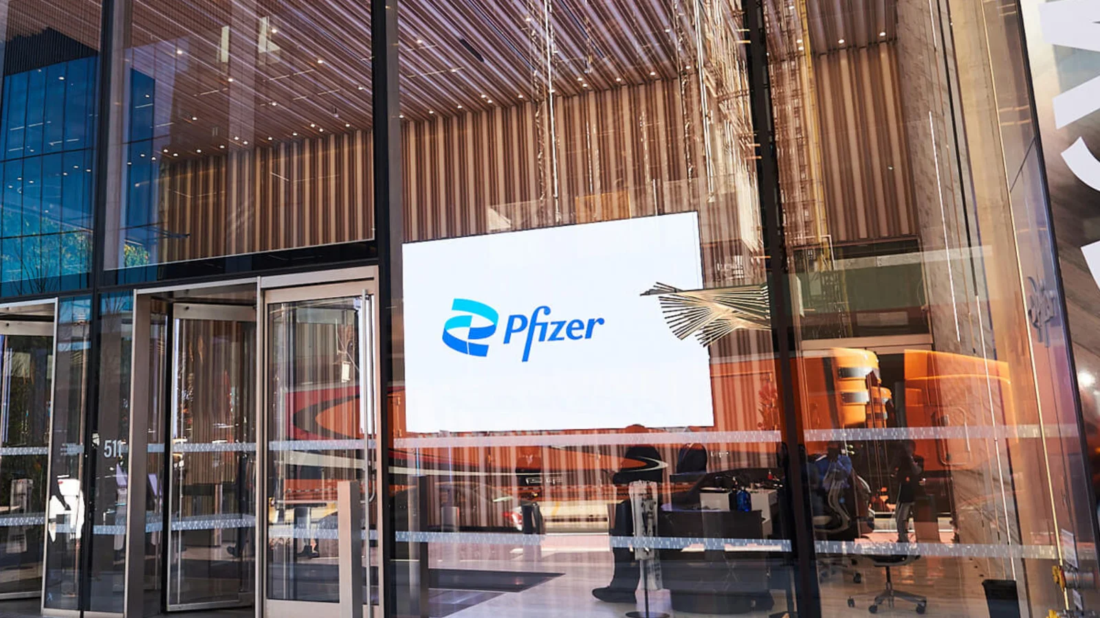 The Pfizer logo at the company’s headquarters entrance