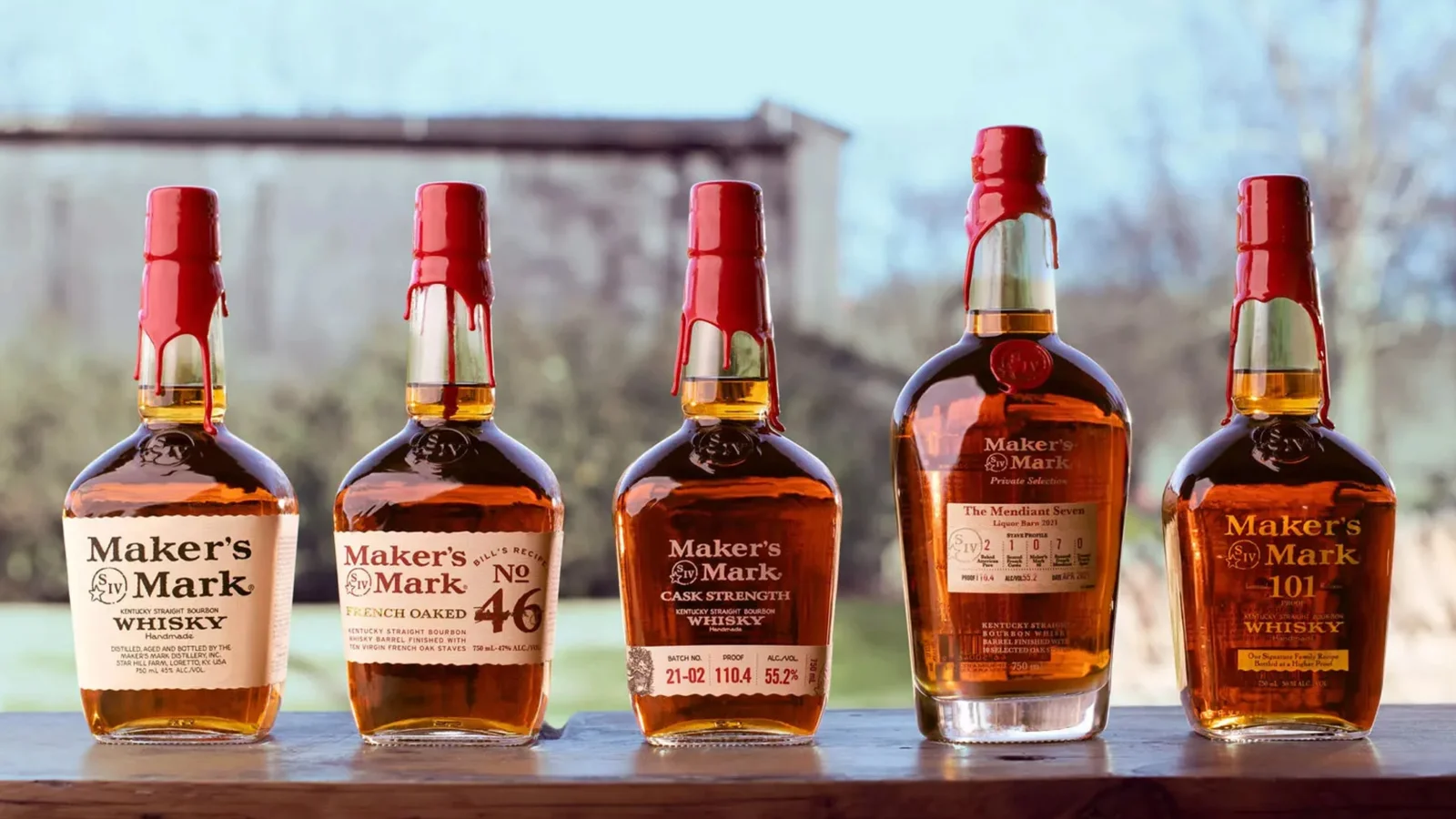 Maker’s Mark bourbon bottles lined up outdoors