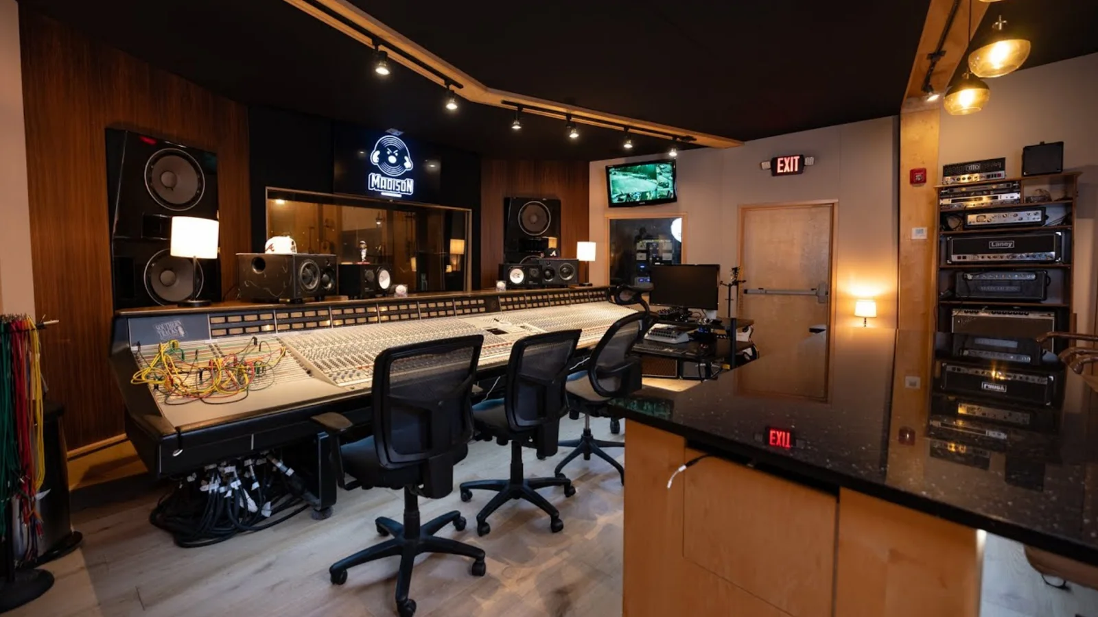 A recording studio control room with racked gear