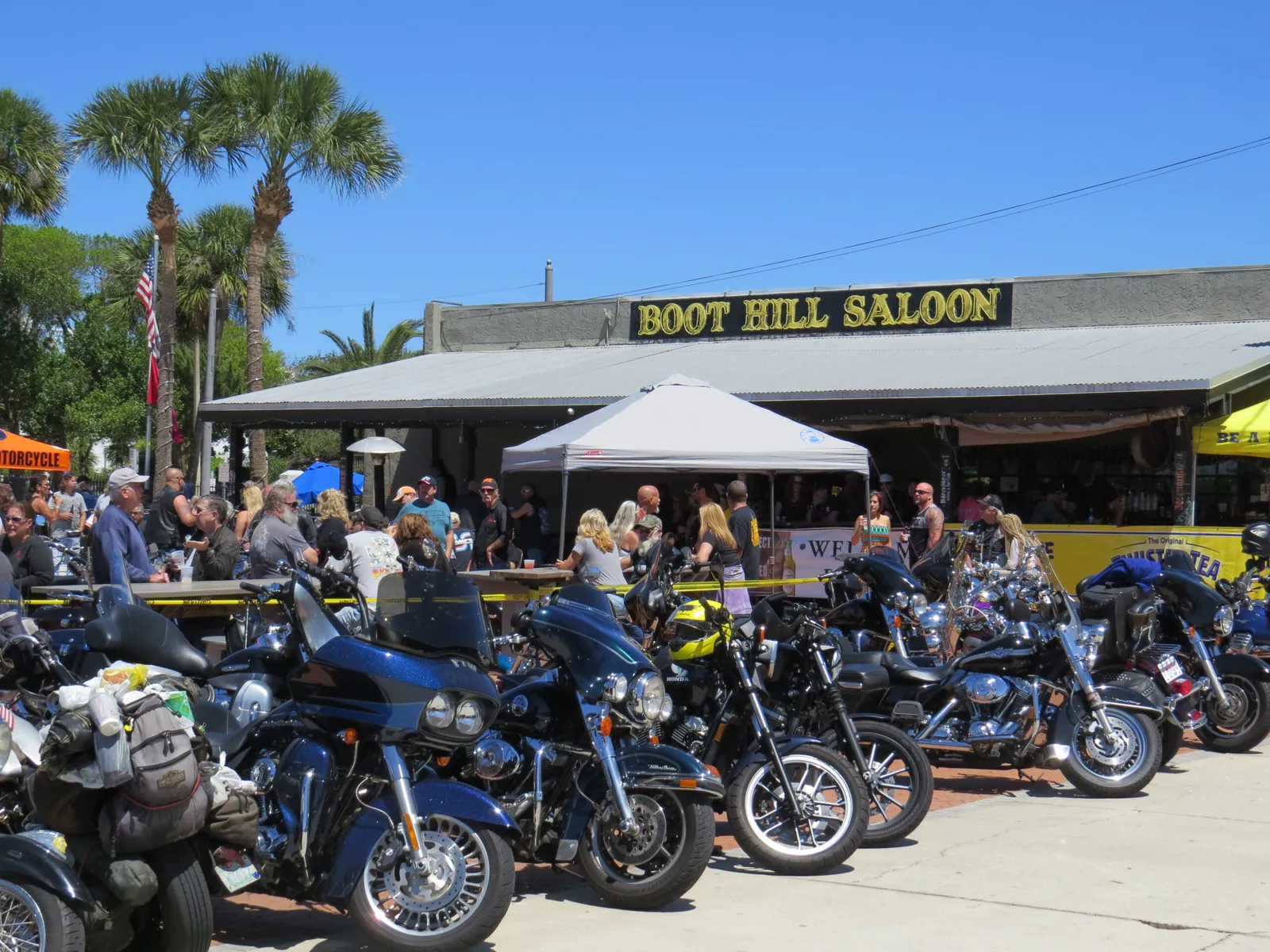 Bikers and rows of motorcycles outside the Boot Hill Saloon in Daytona Beach, Florida