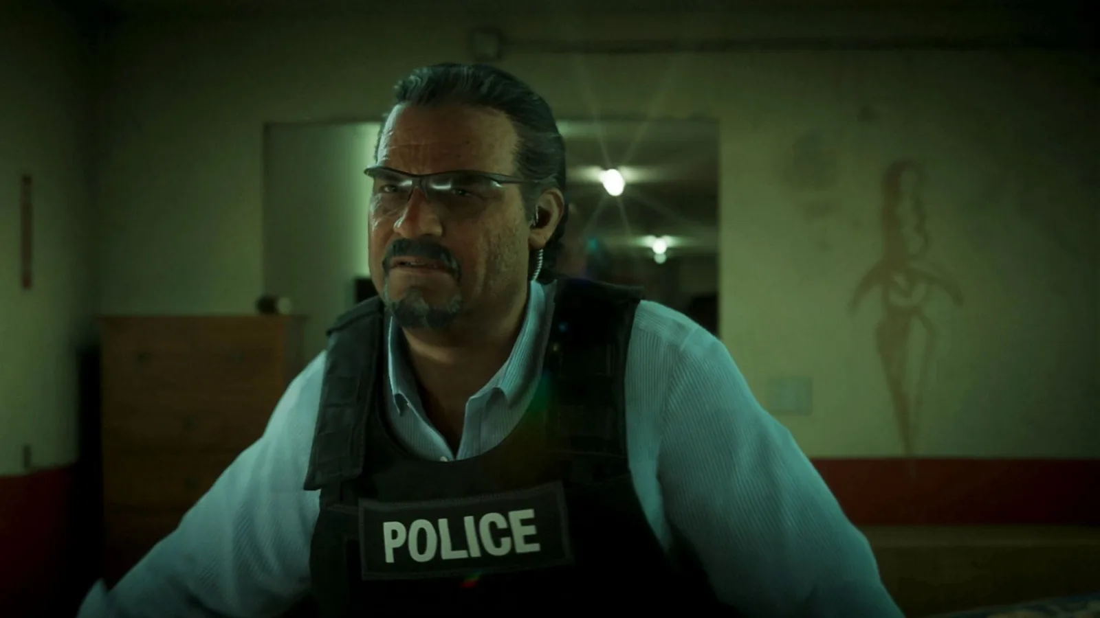 Mendez in glasses and a police tactical vest during the Venture Apartments raid in the GTA 6 Extended Look.