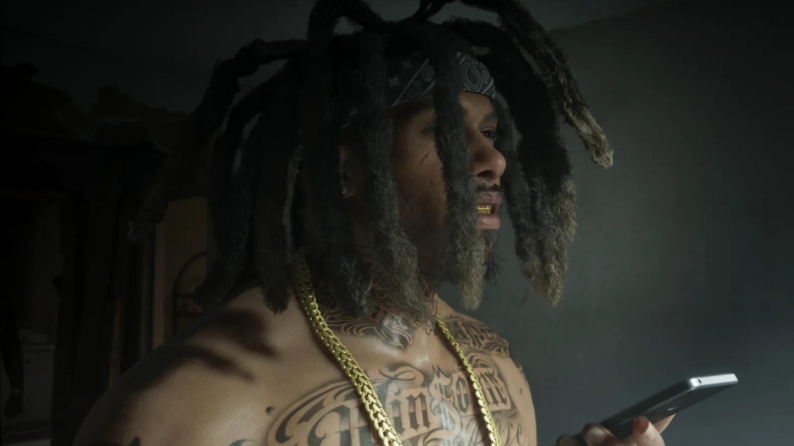 Raymond with long dreads and gold chains taking the speakerphone call inside his Venture Apartments drug lab in GTA 6.
