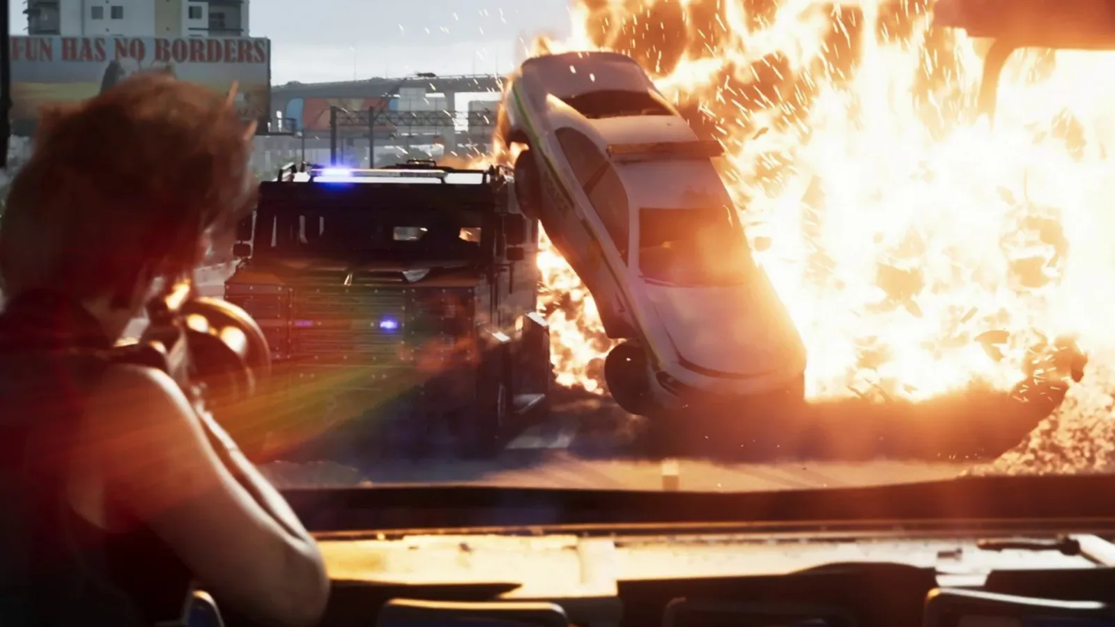A police car engulfed in a fireball behind a riot truck as Lucia watches from a bus window in GTA 6