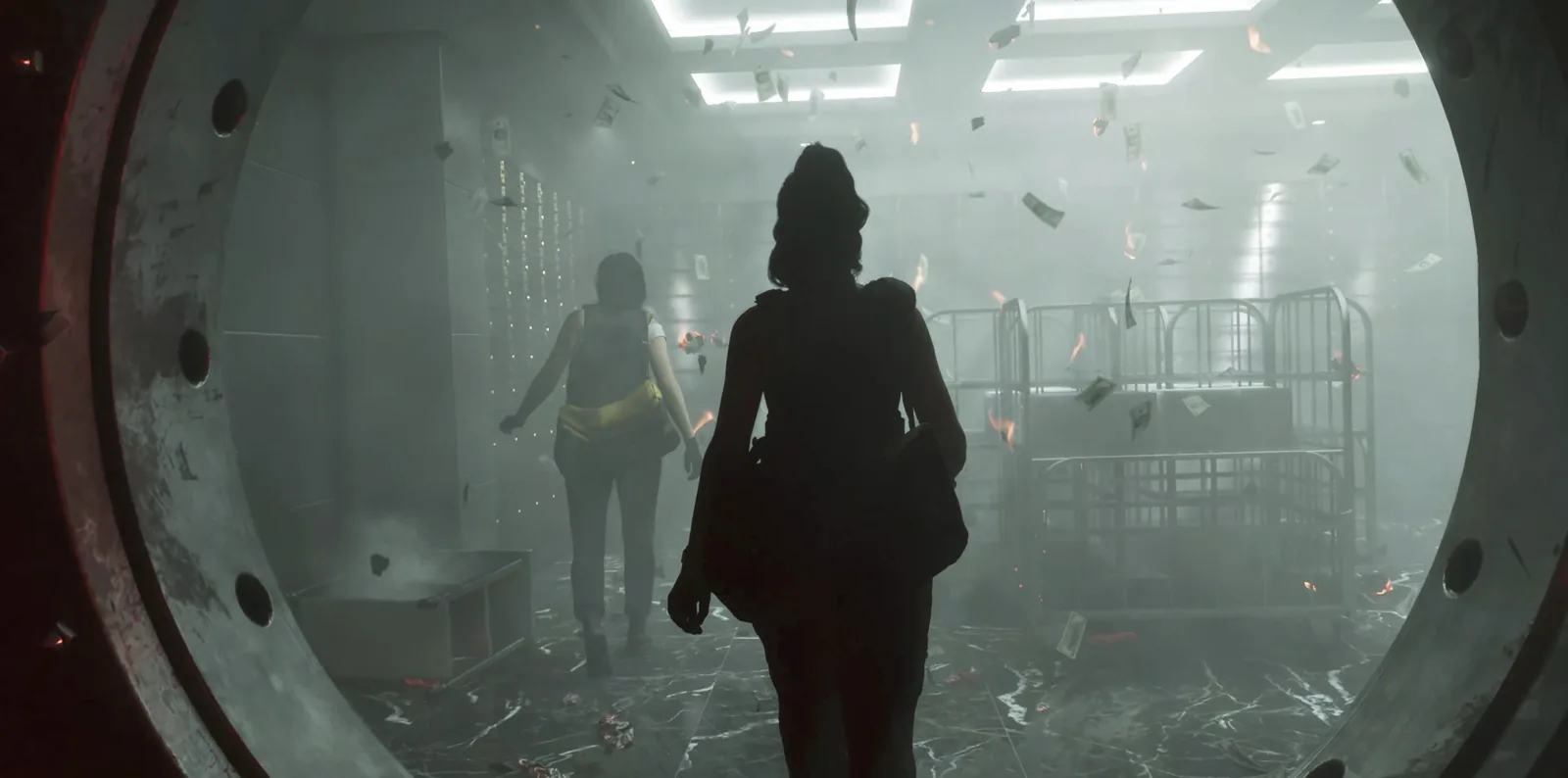 Two women inside a bank vault as banknotes swirl through the air in the GTA 6 launch trailer