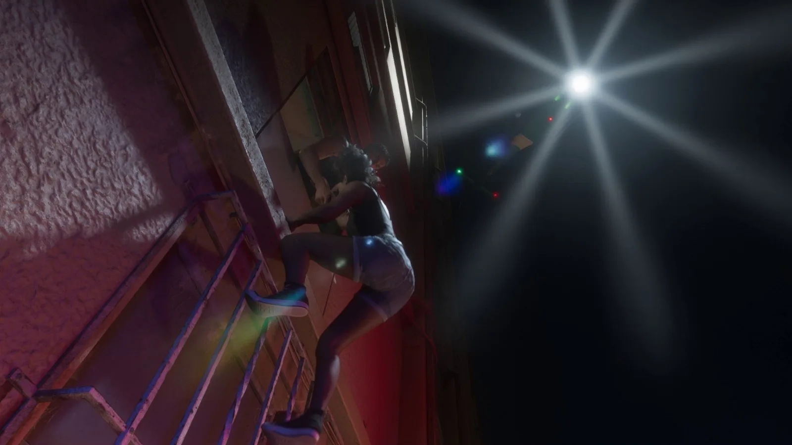 A police searchlight sweeping the outside stairwell of the Venture Apartments during the raid