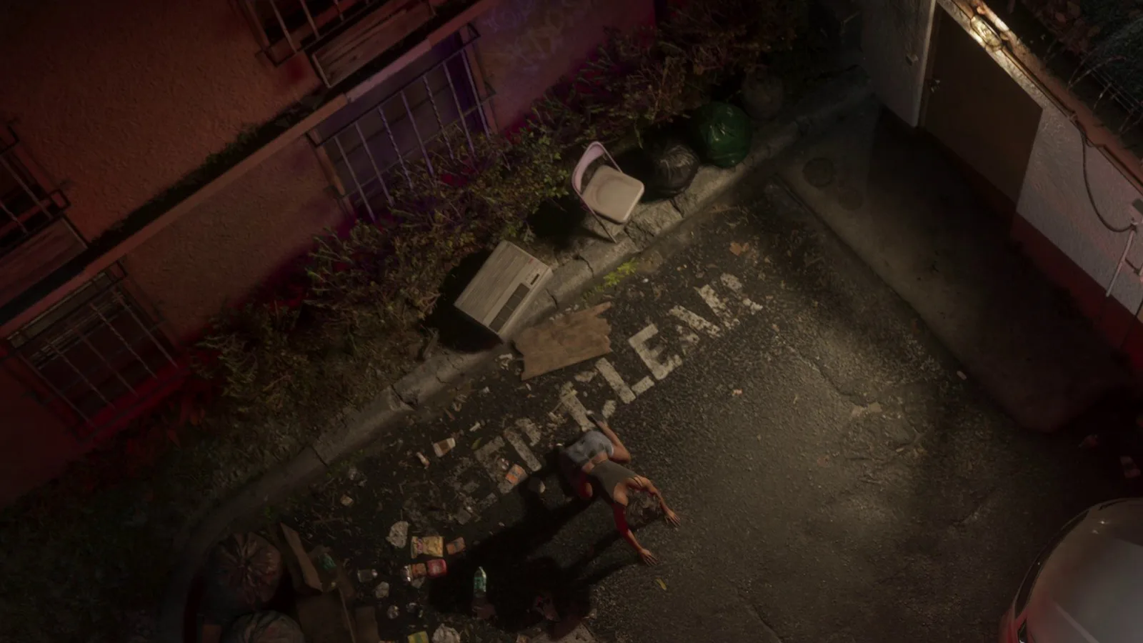 A littered courtyard behind the Venture Apartments seen from above