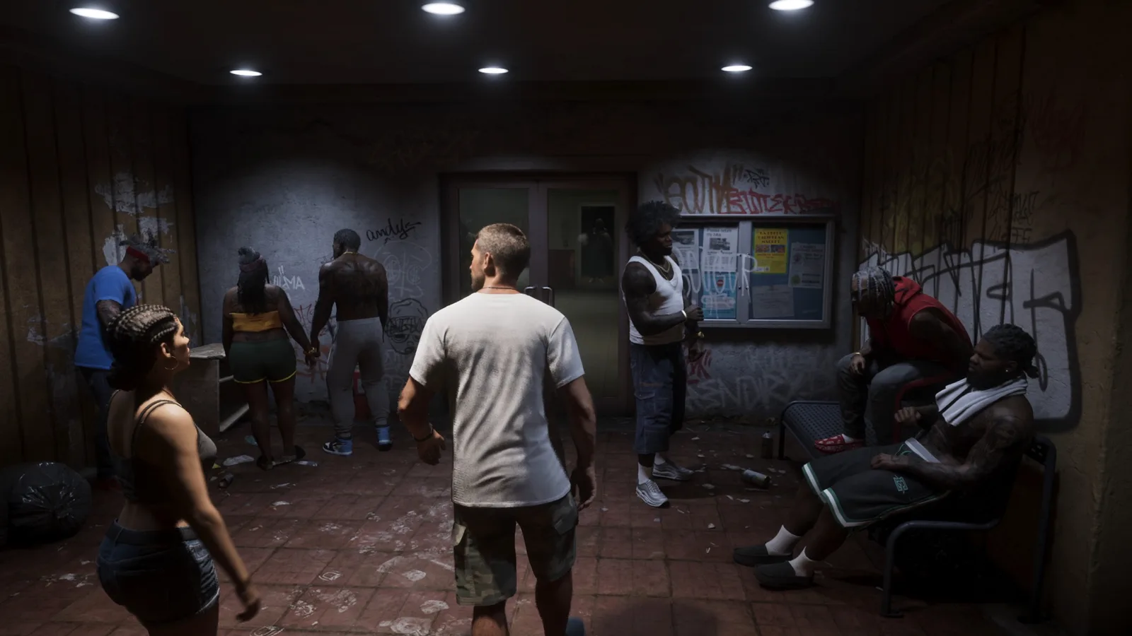 Residents gathered in the Venture Apartments lobby at night