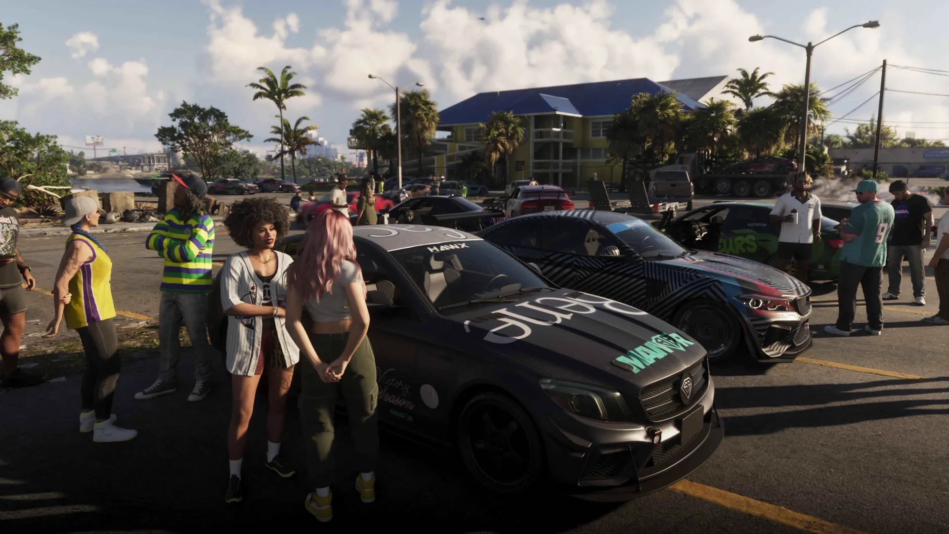 A dense crowd of NPCs gathered between parked cars at a street meet in the GTA 6 Extended Look