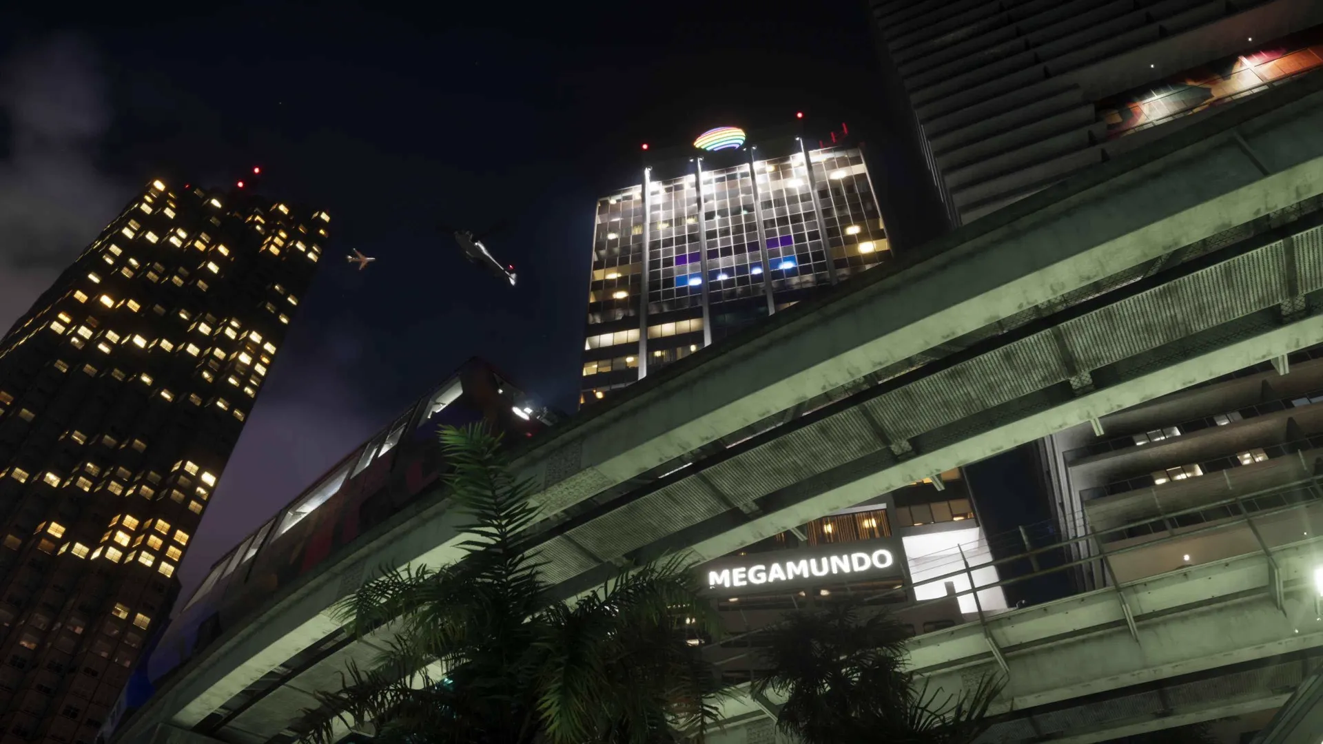 The Megamundo tower lit up at night above the Vice City skyline in GTA 6.