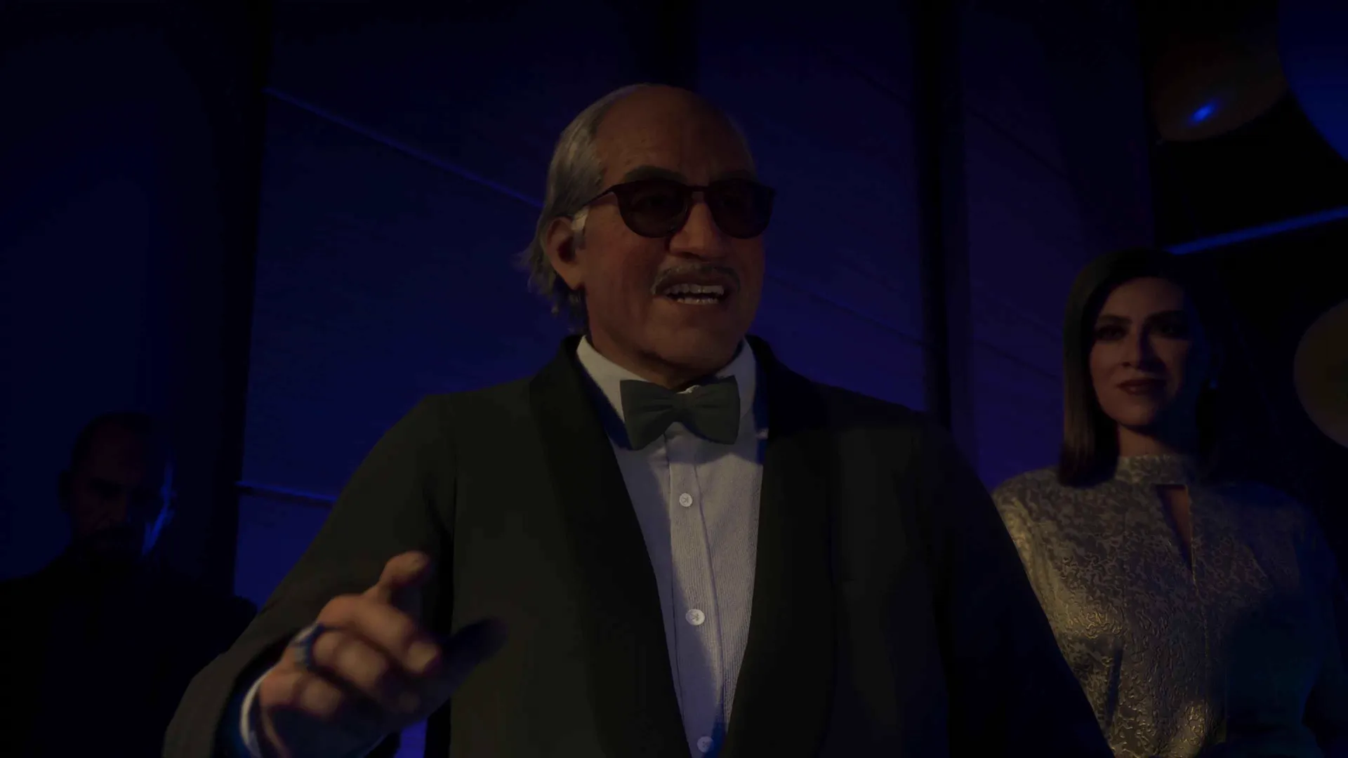 A host in a bow tie working the room at the Megamundo gala in GTA 6.