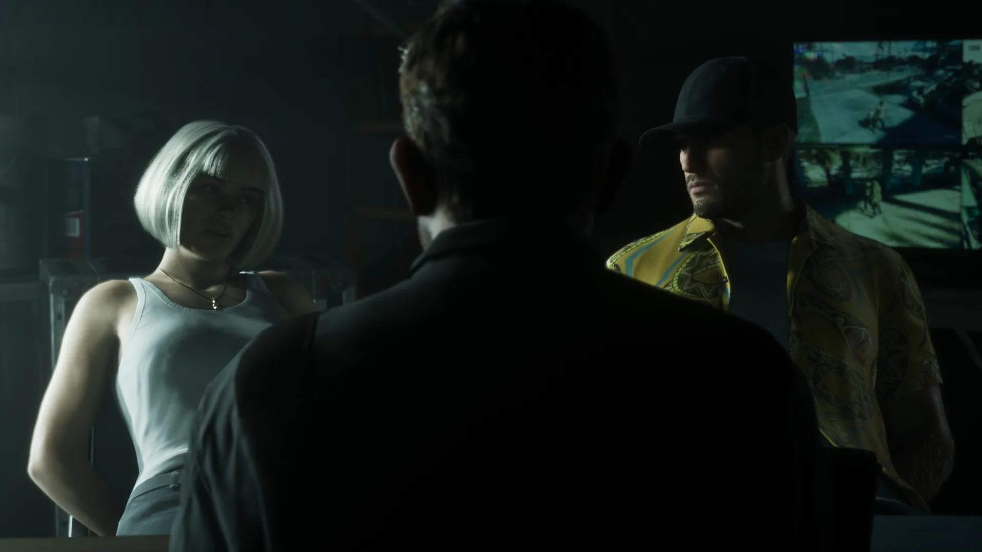 A shadowy meeting in a dark room lit by a wall of monitors in GTA 6