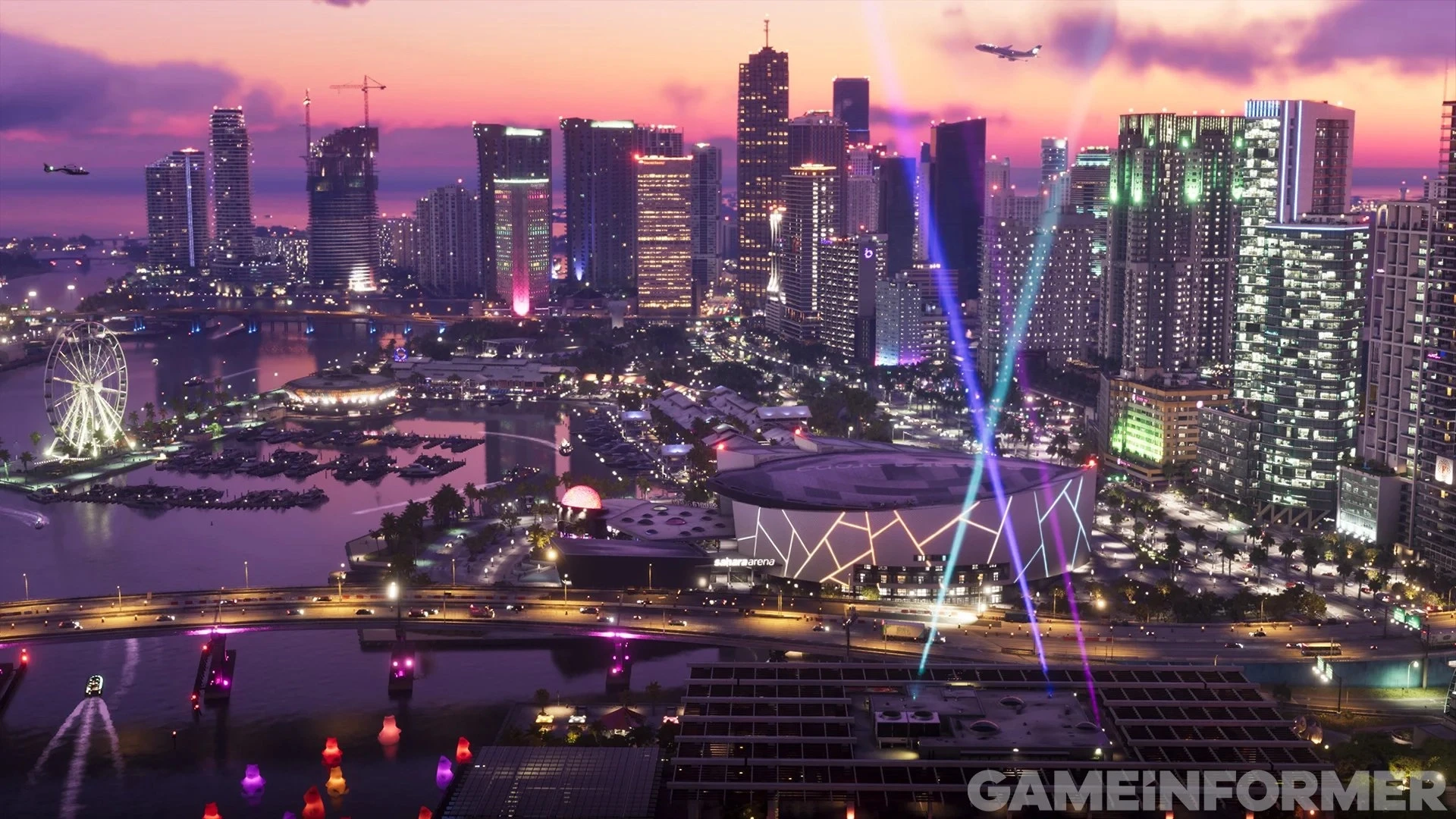 Spotlights and neon light up the Vice City arena district under a clear night sky in GTA 6
