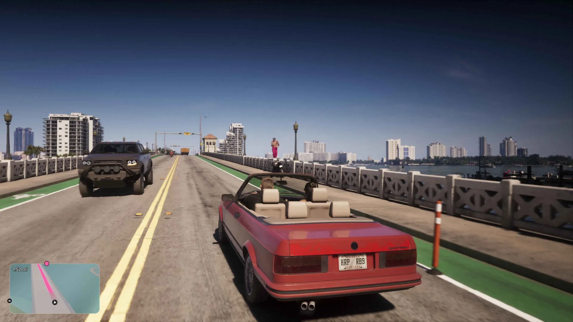A red convertible drives across a bridge in GTA 6 with only a small rounded minimap and a distance counter visible on screen.
