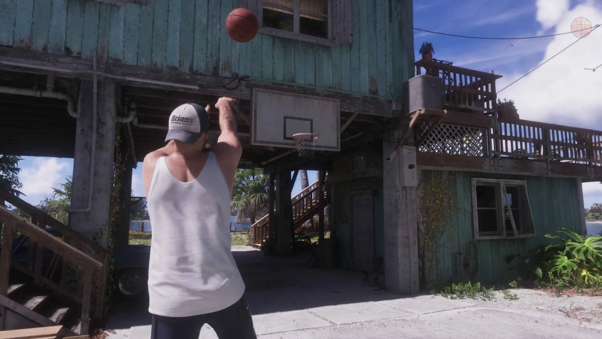 Jason in a white vest and cap shoots a basketball towards a hoop mounted under a stilted turquoise house in GTA 6.