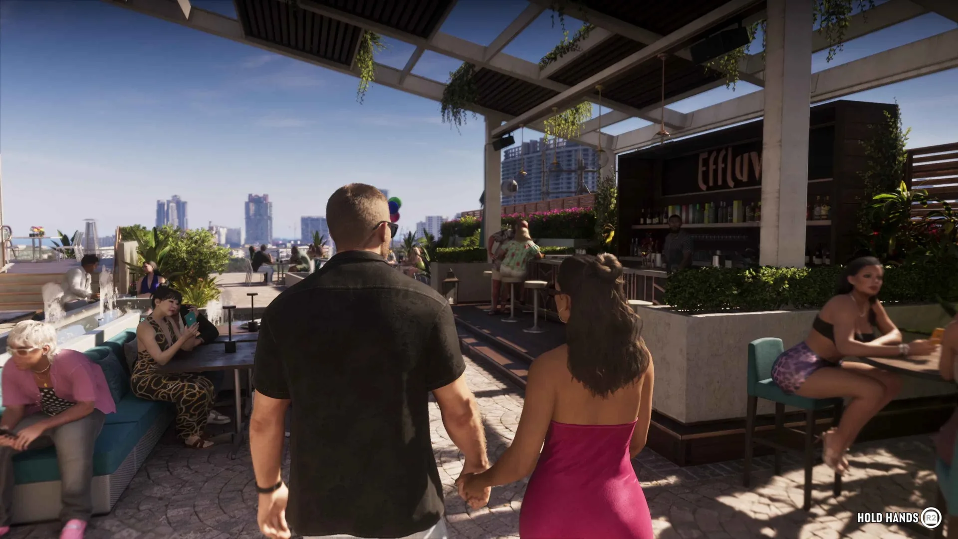 Jason holds hands with Lucia in a pink dress at a rooftop bar in GTA 6 with a Hold Hands R2 prompt on screen.