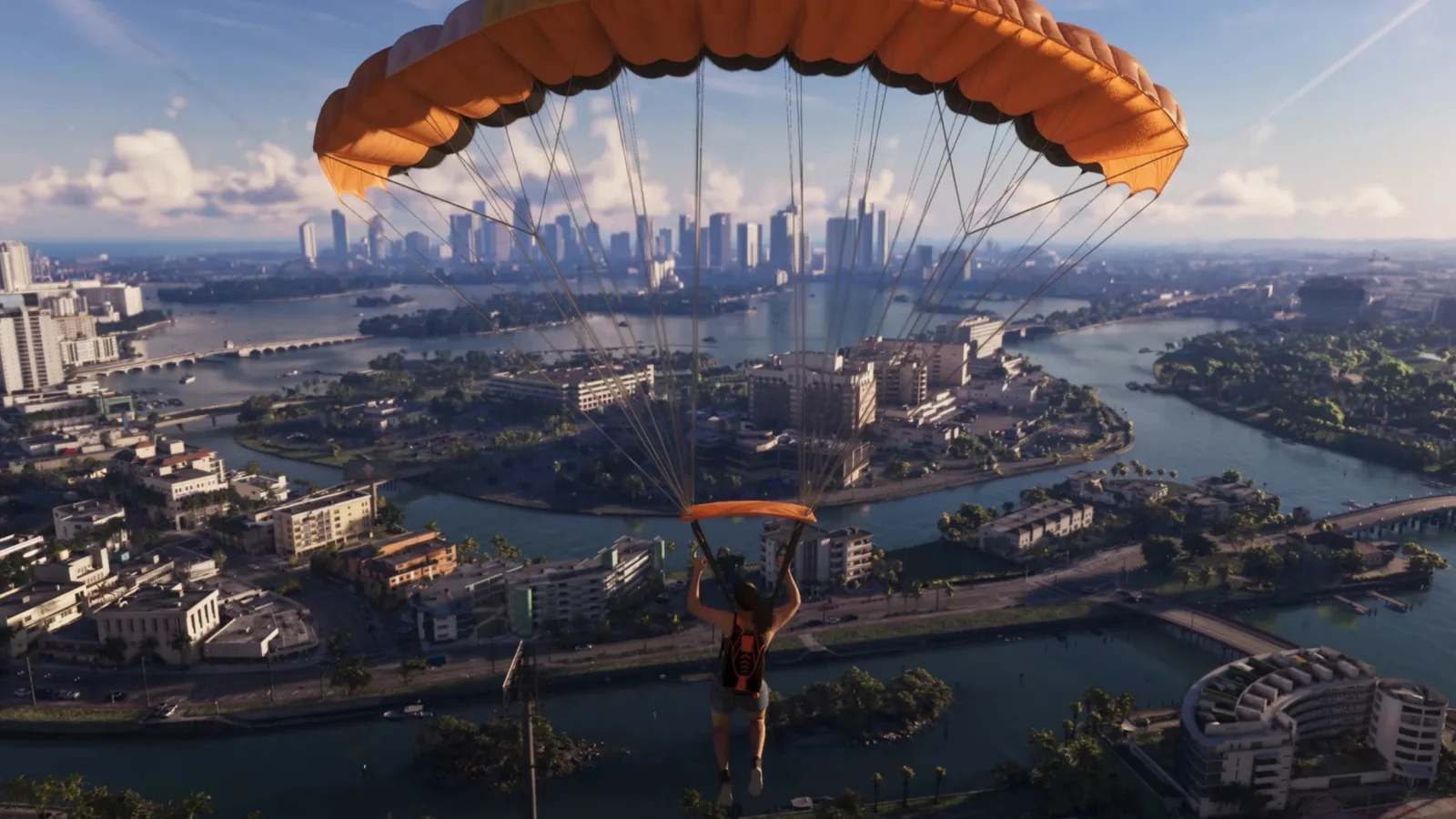 Lucia parachutes over Vice City waterways and low rise island neighbourhoods in GTA 6 under an orange canopy.