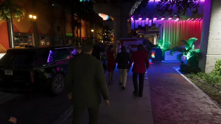 Sidewalk crowd on the neon strip