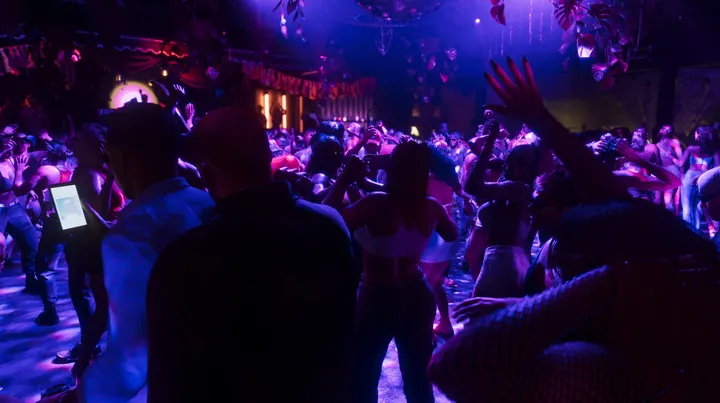Packed dance floor in purple