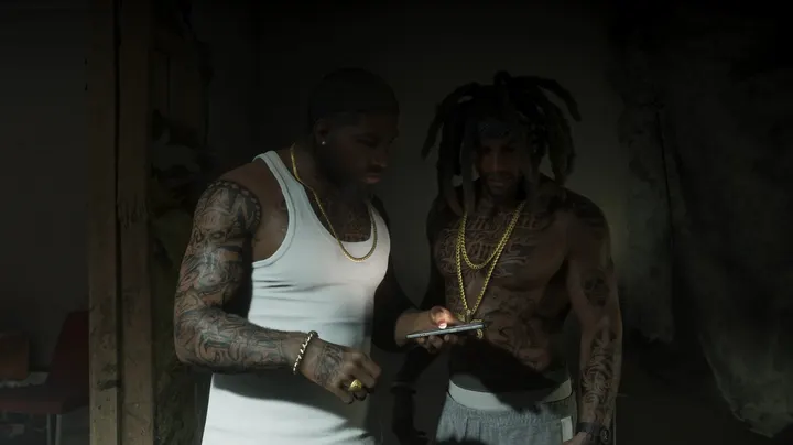 Tattooed pair check a phone