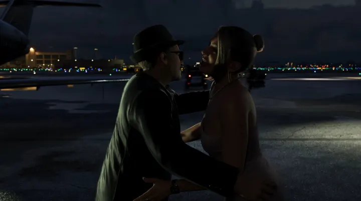 Embrace on the night tarmac