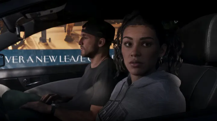Lucia glances from the passenger seat