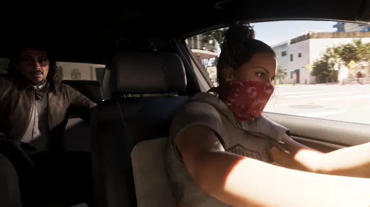 Lucia drives in a red bandana